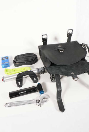 leather cycling tool back, black color leather, showing what tools can go in the bag